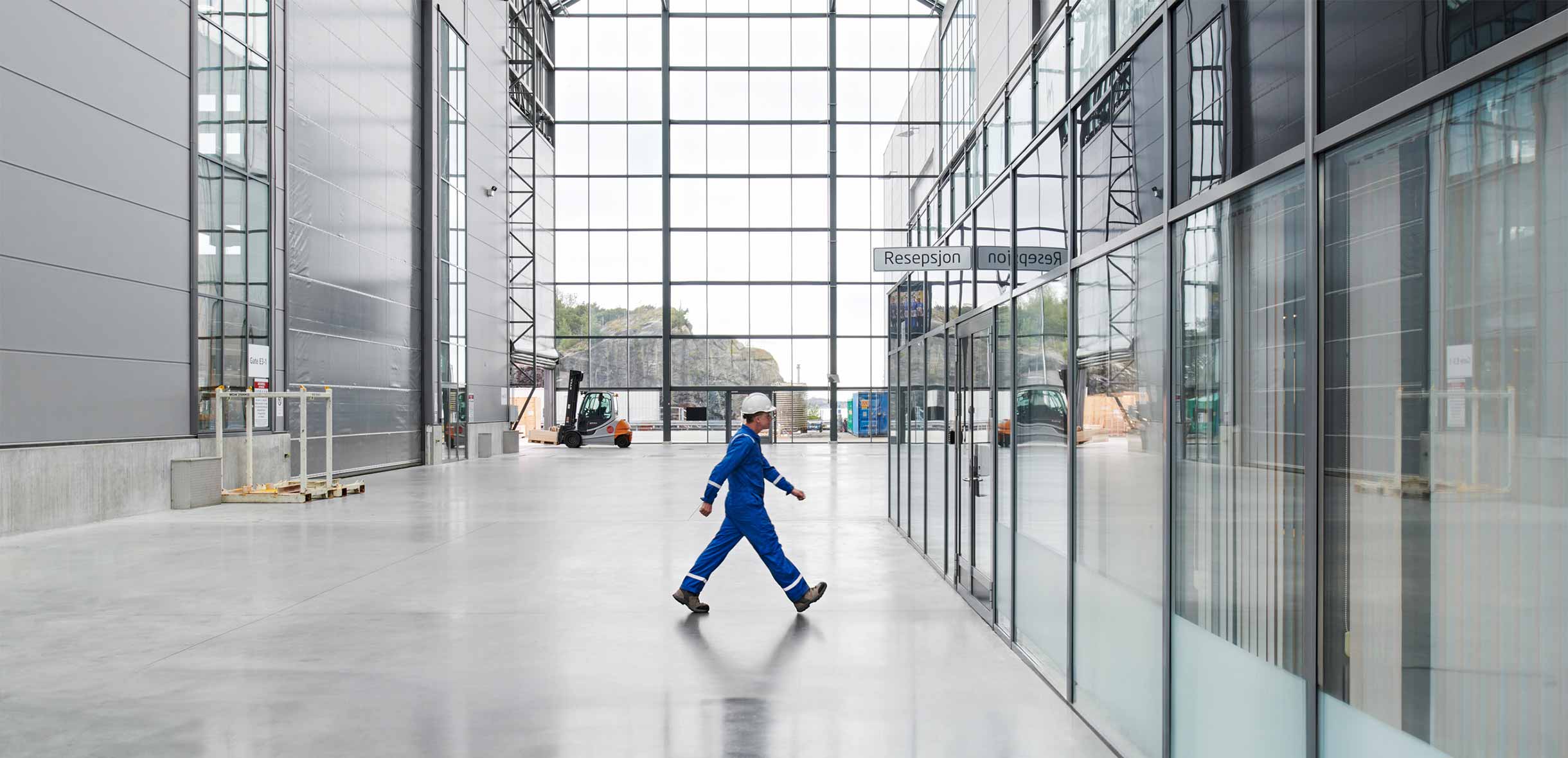 SLB operator walking across a facility floor